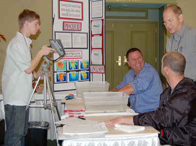 Shay Edwards, left, discusses his project with attendees at IR/Info 2008