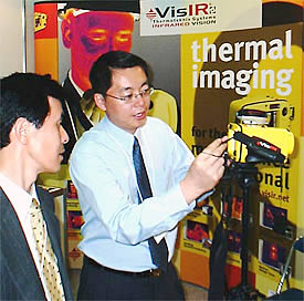 Regional Sales Manager, David Ge, demonstrating Thermoteknix' VisIR® Ti 200 infrared camera at InterMaintech Maintenance Tradeshow in Tokyo.
